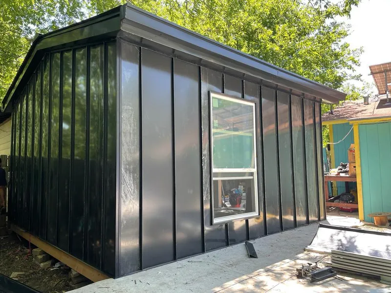 Black standing seam metal wall panels for Roof Inspection in Annandale