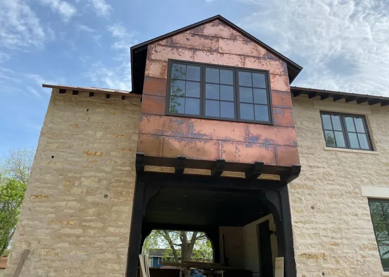 Copper metal panel facade on a stone building for Skylight Installation in Annandale